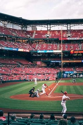 mark mcguire baseball hitter bitting at the cardinals stadium