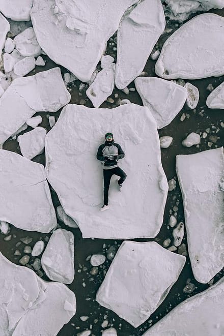 man laying down on broken ice