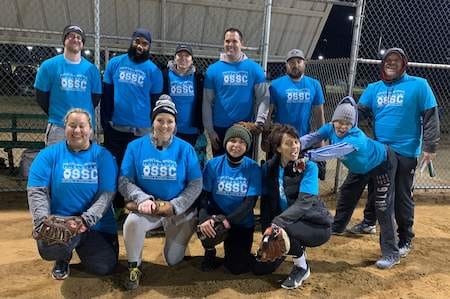 social softball team wearing matching tshirt uniform