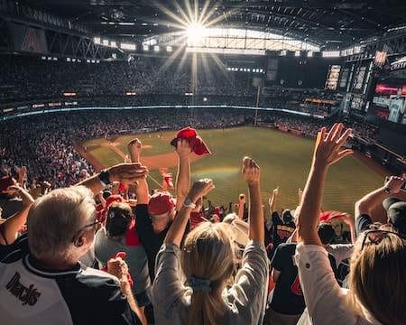 fans cheering in the seats of a baseball stadium