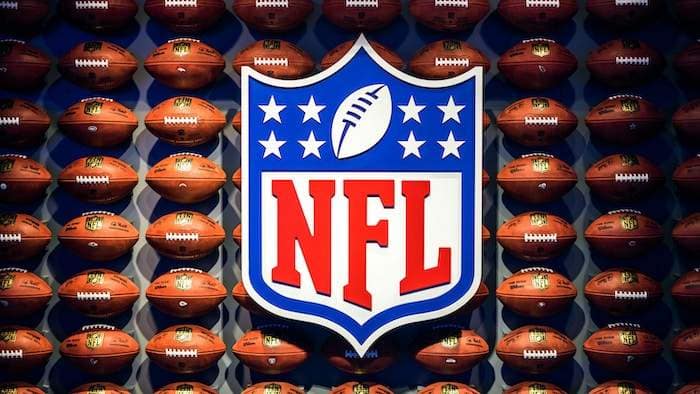 NFL logo with footballs on the wall