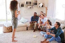 group of people using the charades generator to play charades!